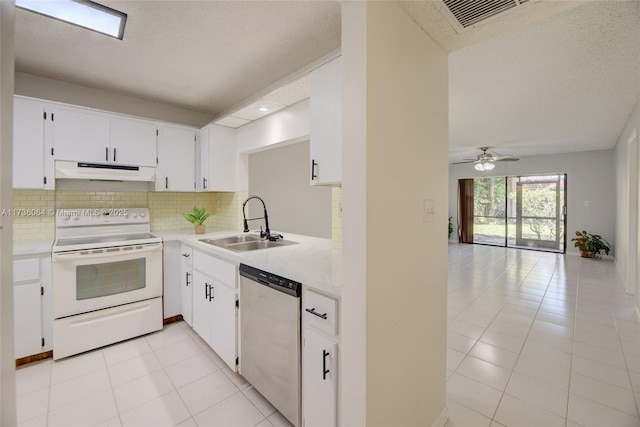 kitchen with white electric range, tasteful backsplash, dishwasher, sink, and white cabinets