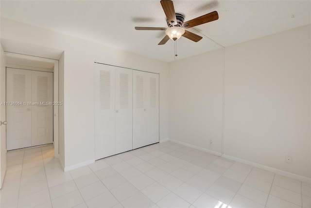 unfurnished bedroom featuring a closet and ceiling fan