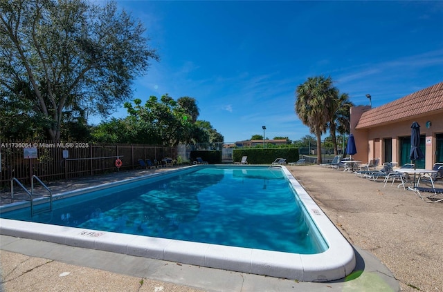 view of swimming pool with a patio area