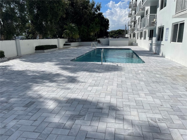 view of swimming pool featuring a patio