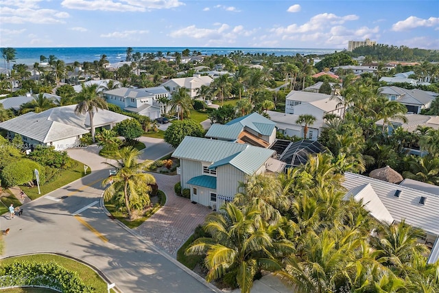 bird's eye view with a water view and a residential view