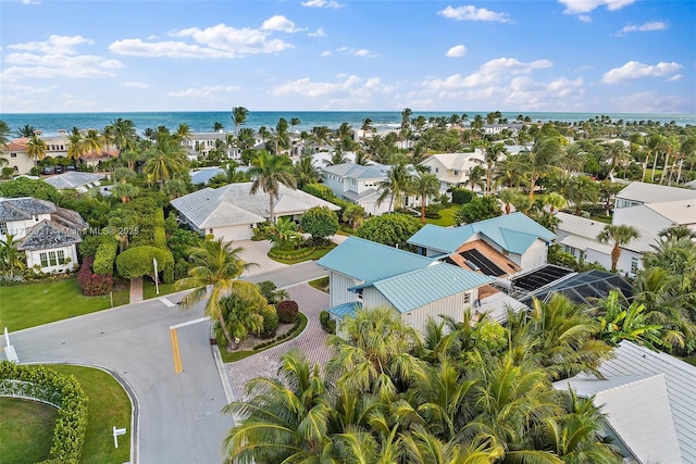 drone / aerial view featuring a water view and a residential view