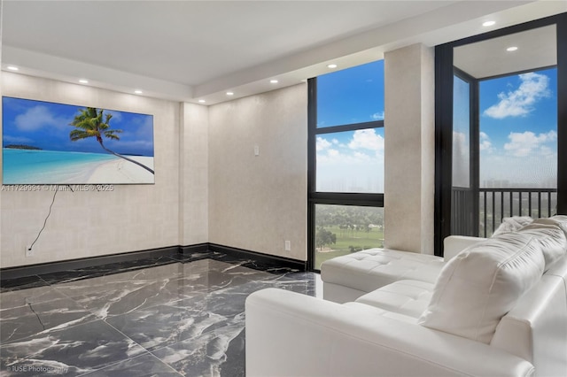 living room with floor to ceiling windows