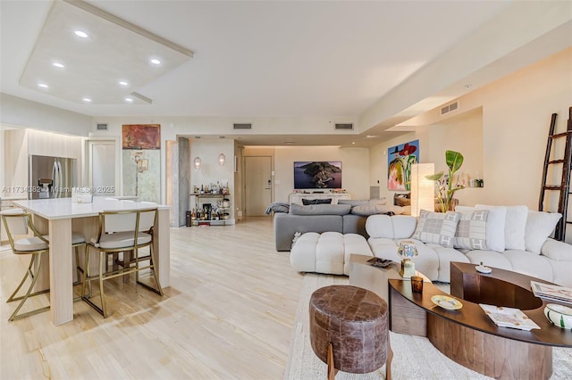 living room with light hardwood / wood-style floors