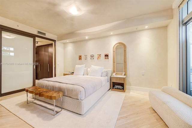 bedroom with light hardwood / wood-style flooring