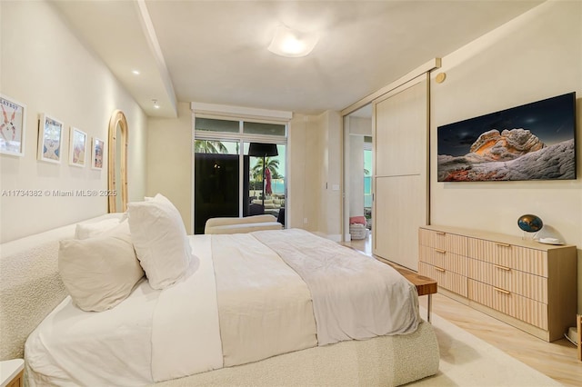 bedroom with light hardwood / wood-style floors