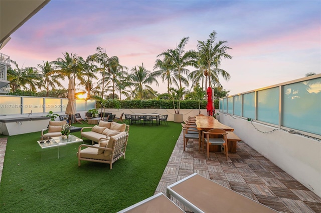 exterior space featuring an outdoor living space and a lawn