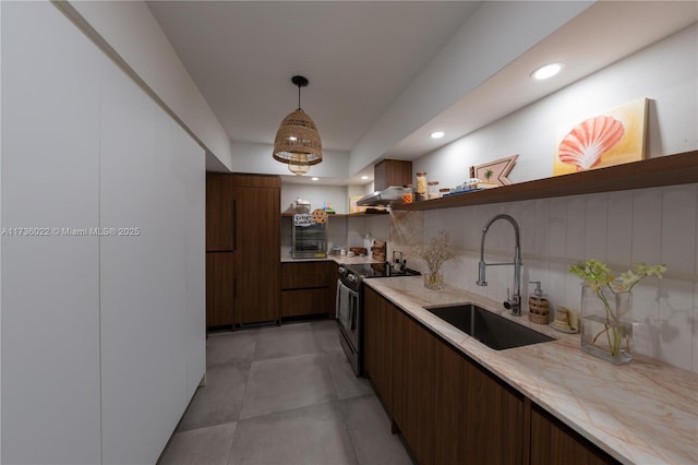 kitchen featuring sink, dark brown cabinetry, decorative backsplash, decorative light fixtures, and stainless steel range with electric cooktop