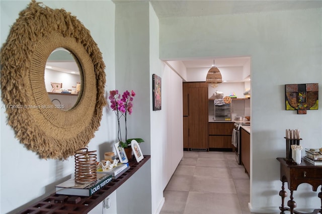 corridor featuring light tile patterned floors