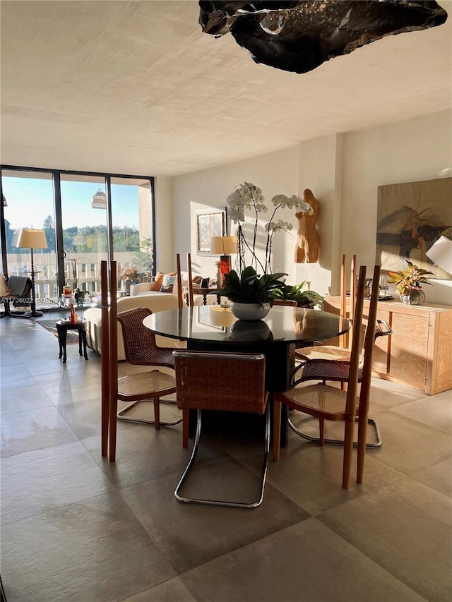 dining space featuring expansive windows