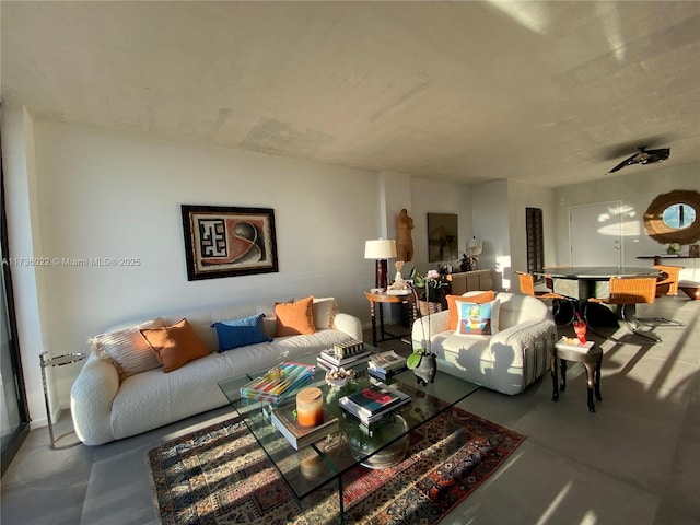 living room featuring concrete floors