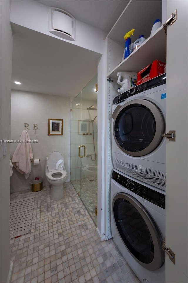 laundry room featuring stacked washer / dryer