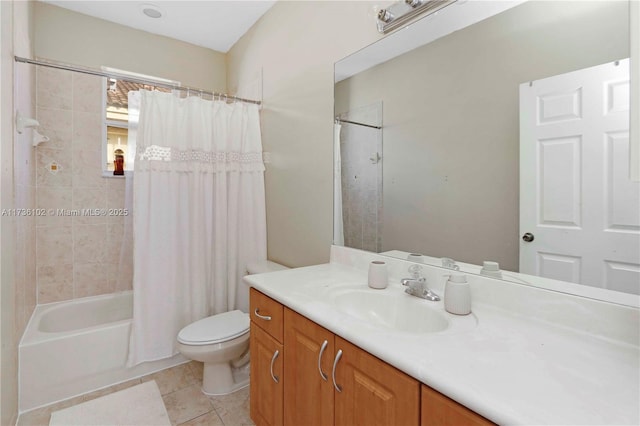 full bathroom with toilet, tile patterned flooring, shower / bath combo with shower curtain, and vanity