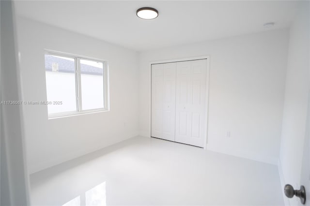 unfurnished bedroom with a closet