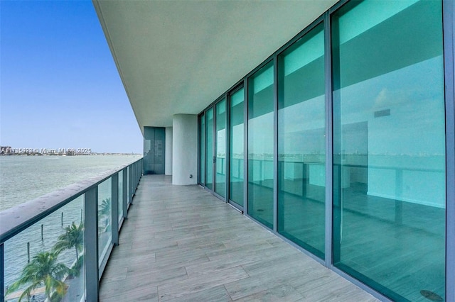 balcony featuring a water view