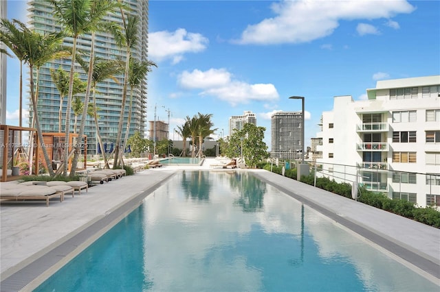 view of swimming pool featuring a patio area