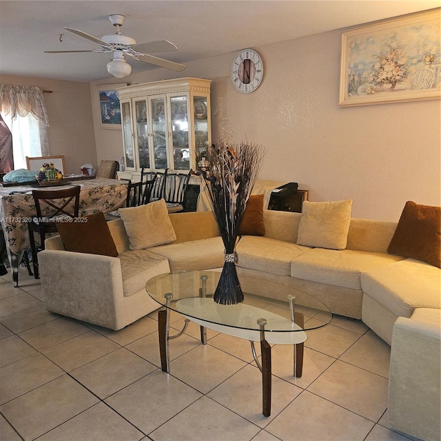 living room with light tile patterned flooring and ceiling fan