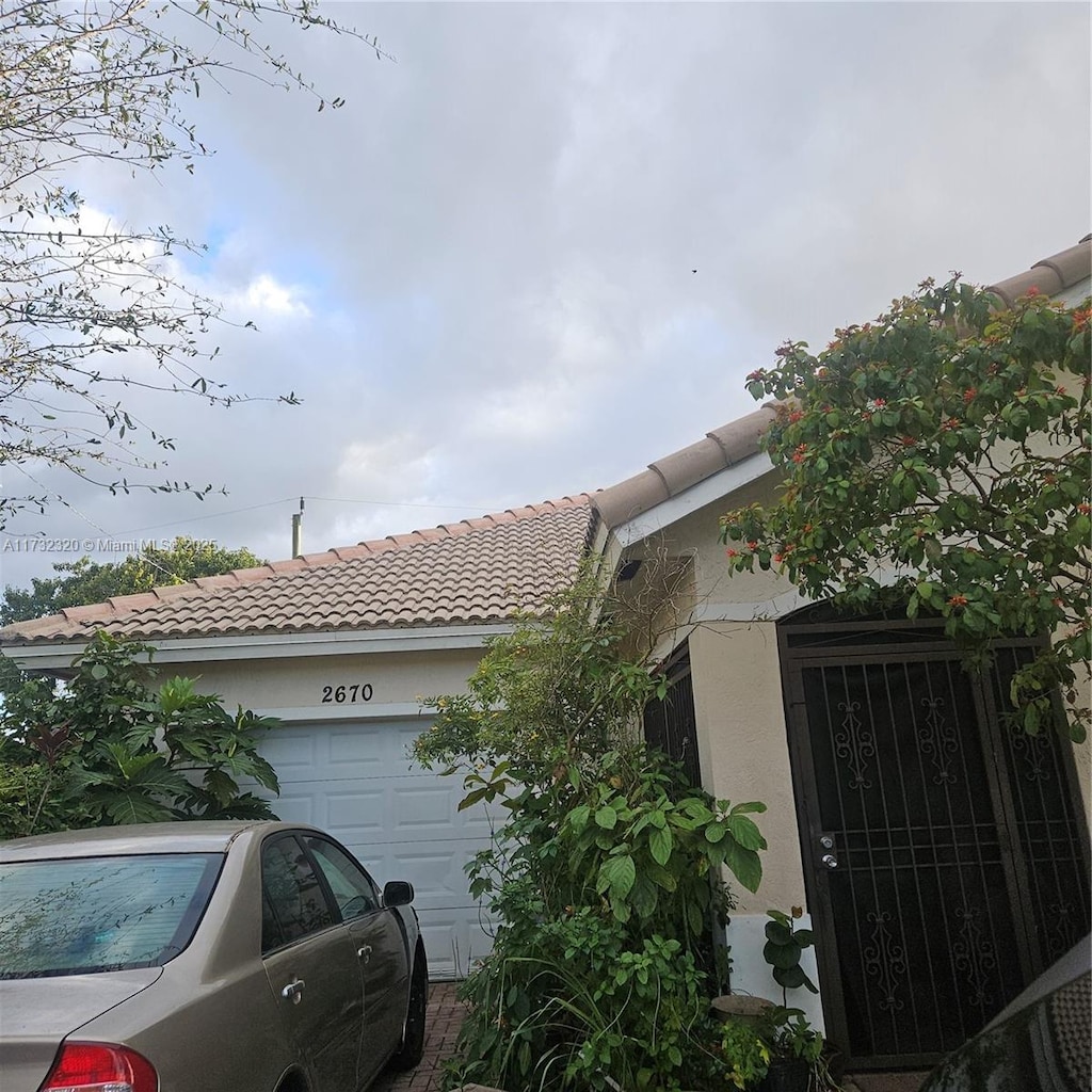 view of side of property featuring a garage