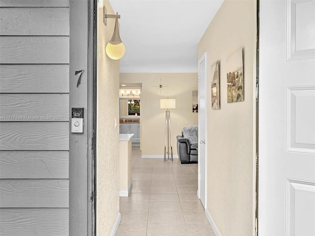 hall featuring light tile patterned floors