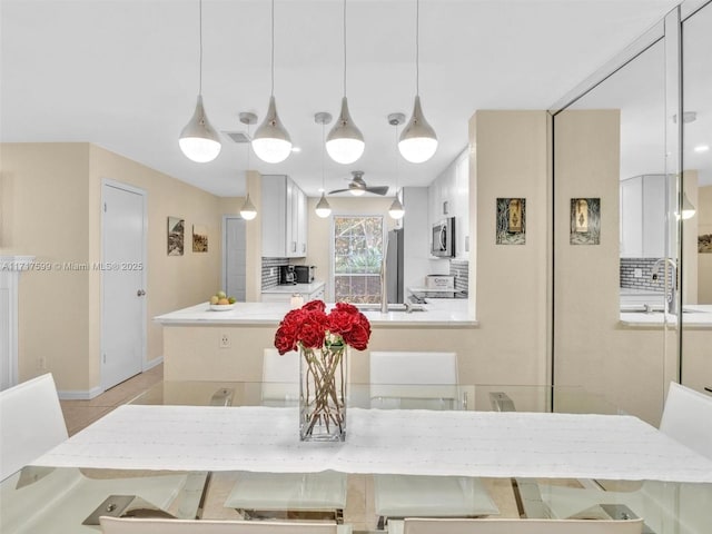 dining room featuring sink