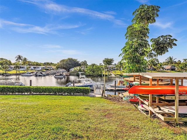 view of dock featuring a yard and a water view