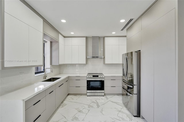 kitchen with sink, backsplash, wall chimney exhaust hood, and appliances with stainless steel finishes