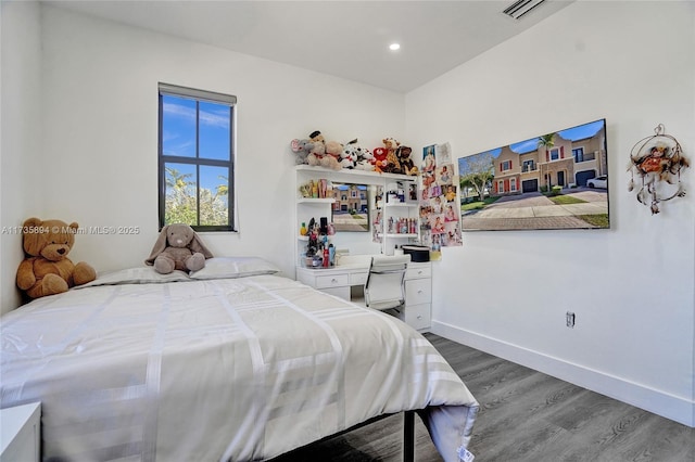 bedroom with wood-type flooring