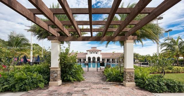 view of patio featuring a community pool and a pergola