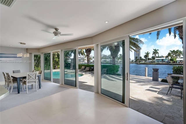 interior space with a ceiling fan, recessed lighting, visible vents, and a water view