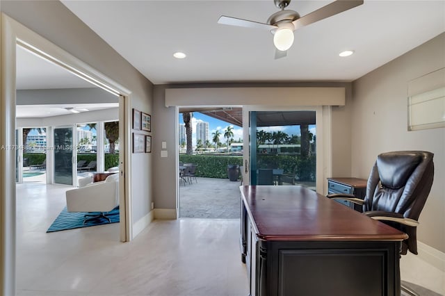 office area with a ceiling fan, recessed lighting, and baseboards