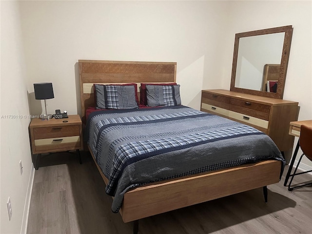 bedroom with hardwood / wood-style flooring