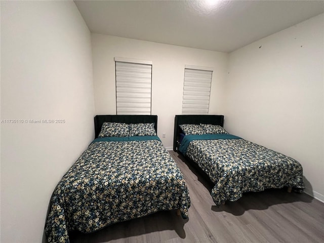 bedroom with wood-type flooring