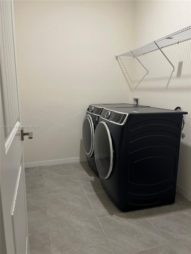 laundry room with washer and dryer