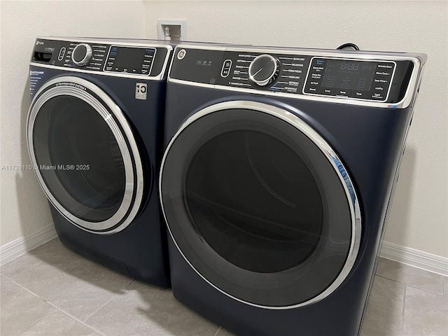 laundry area featuring washing machine and clothes dryer