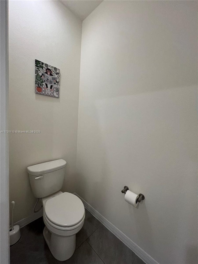 bathroom with tile patterned flooring and toilet