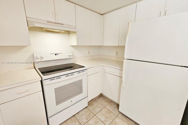 kitchen featuring white cabinetry, light tile patterned floors, and white appliances