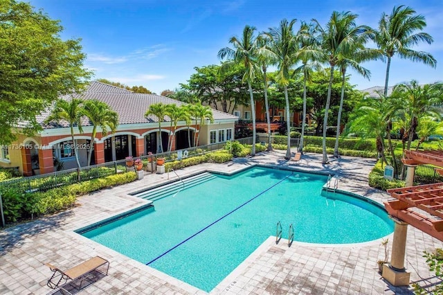 view of swimming pool with a patio area and a pergola