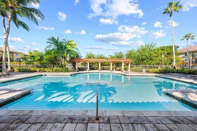 view of swimming pool with a pergola