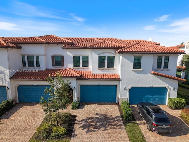 mediterranean / spanish house featuring a garage