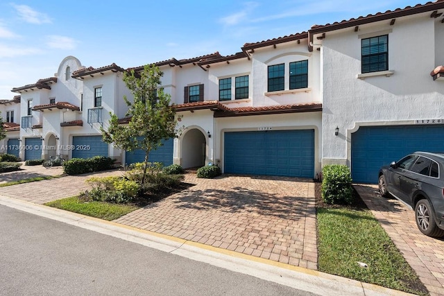 mediterranean / spanish-style home featuring a garage