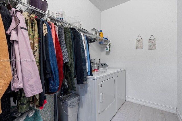 washroom featuring washer and clothes dryer