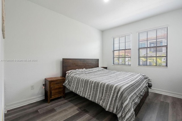 bedroom featuring dark hardwood / wood-style flooring