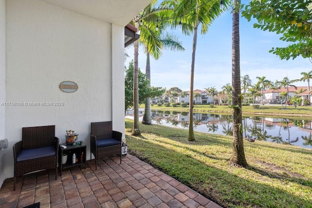 view of patio / terrace with a water view