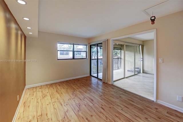 spare room featuring light wood-type flooring