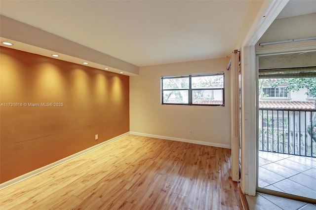 spare room with light wood-type flooring