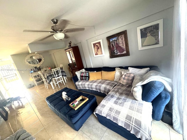 tiled living room with ceiling fan