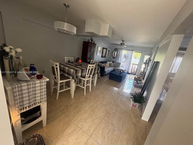 dining area with ceiling fan and light tile patterned flooring