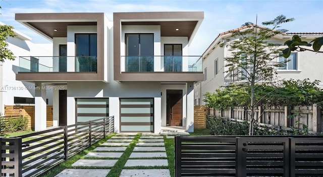 view of front of home featuring a balcony