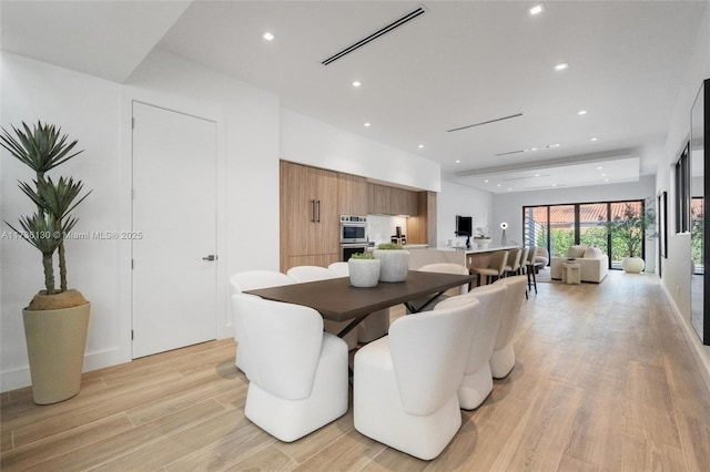 dining room with light hardwood / wood-style floors