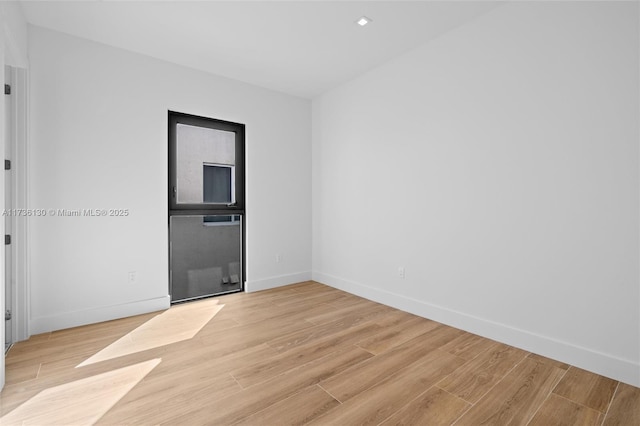 unfurnished room featuring light wood-type flooring